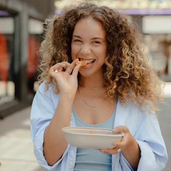 woman eating from new packaging
